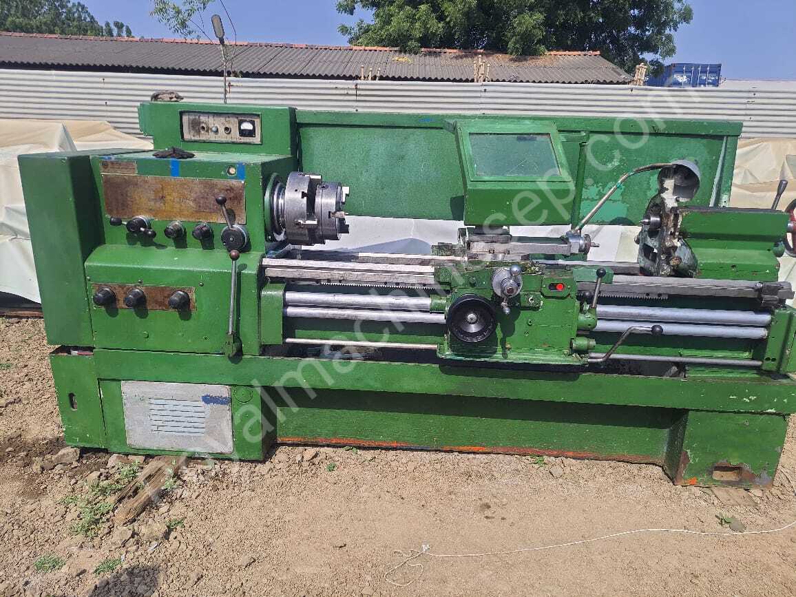 large, green industrial lathe machine